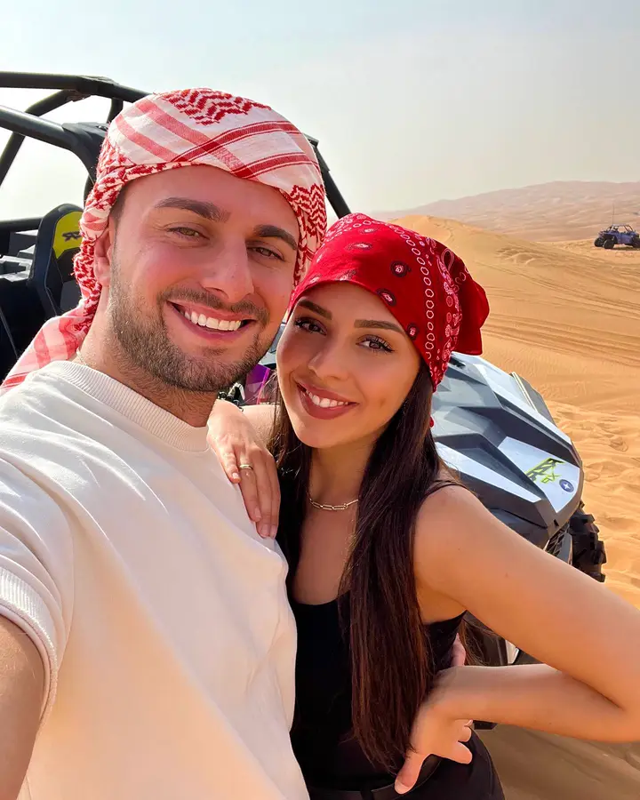 Couple with a Polaris RZR dune buggy on a Dubai desert safari — guest photo 2