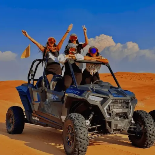 Family in a 4-seater Polaris RZR dune buggy in the Dubai desert