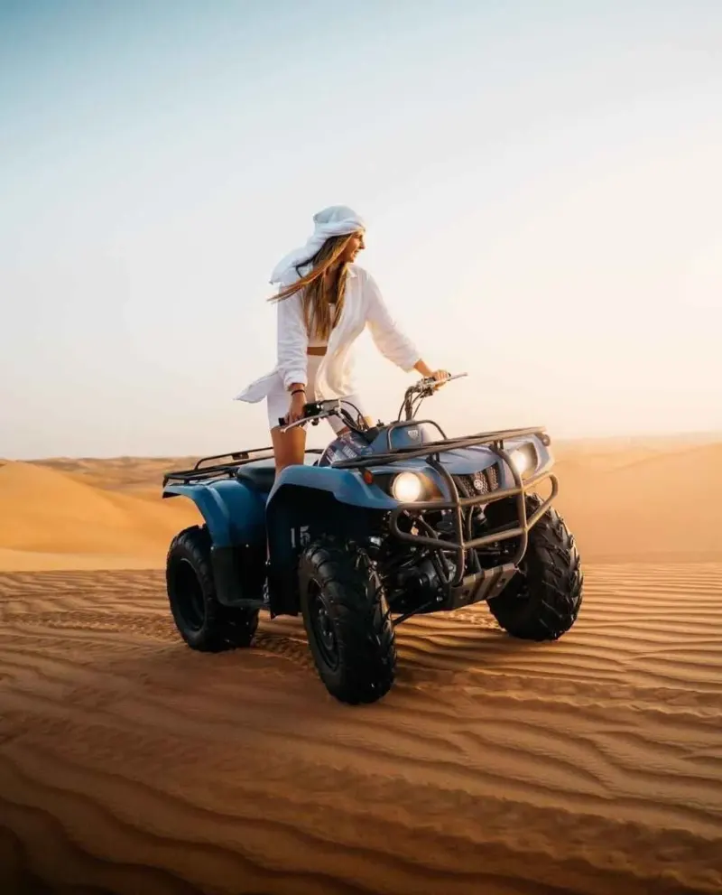 Quad bike rider on the open dunes at the Dubai desert safari